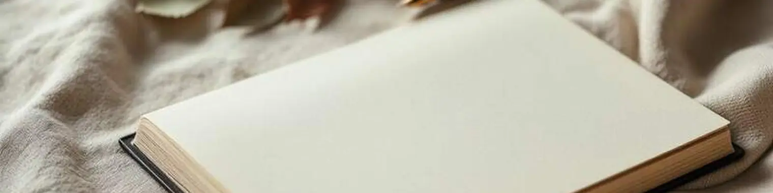 An open journal and pen on a desk